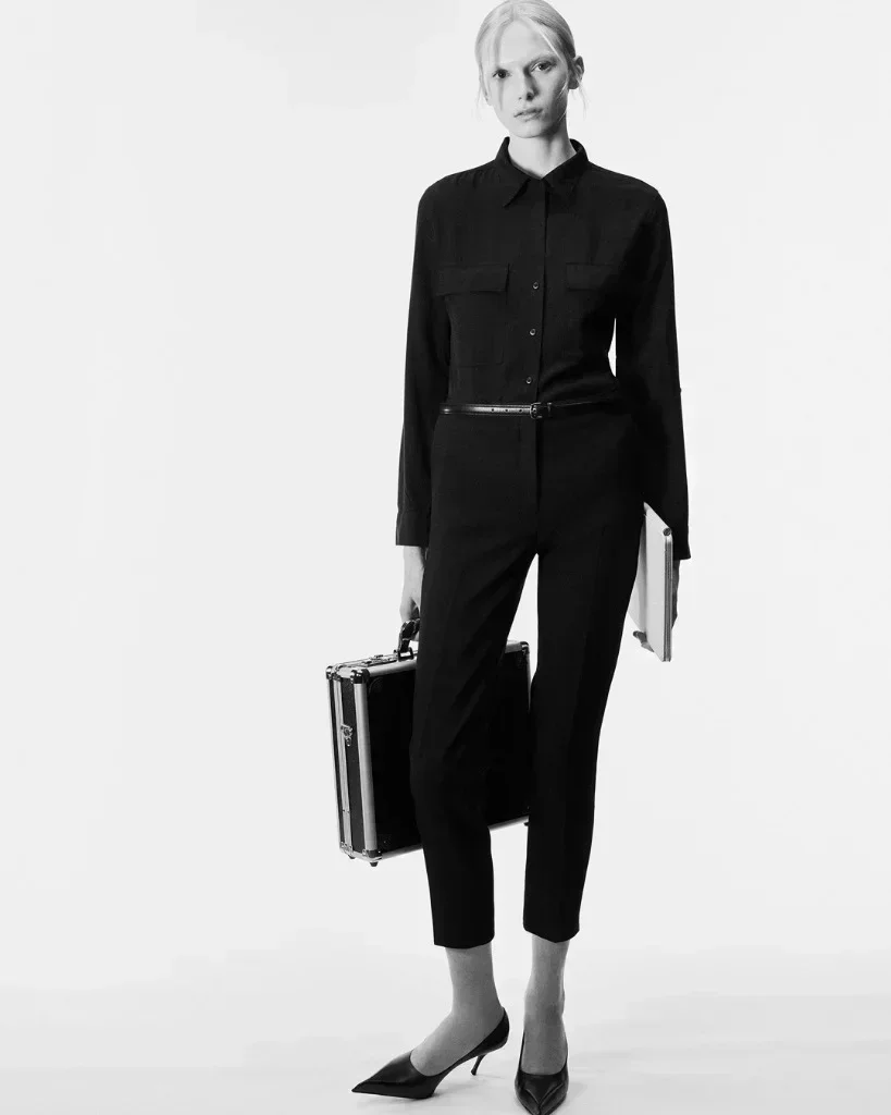 Alex Consani in monochromatic black utility tailoring