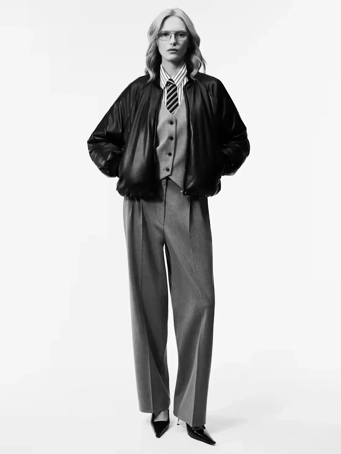 Alex Consani in leather bomber jacket and Deniro Vest suiting