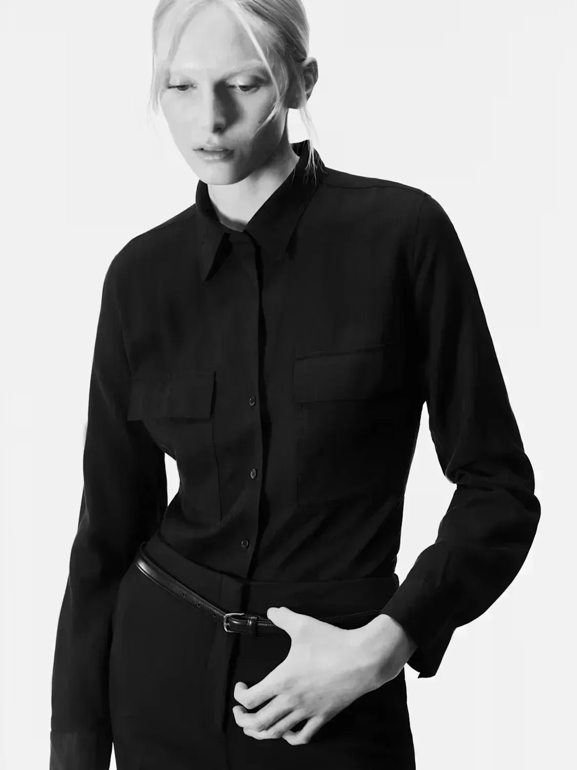 Alex Consani in black utility button-down shirting