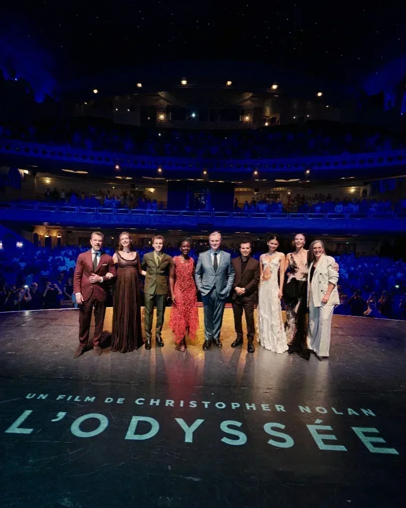 The cast and filmmakers of The Odyssey on stage at Le Grand Rex in Paris