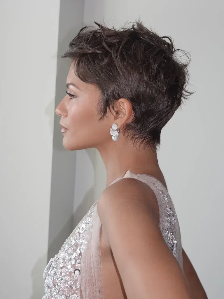 Side profile of Zendaya's cropped pixie haircut and Mikimoto pearl earrings