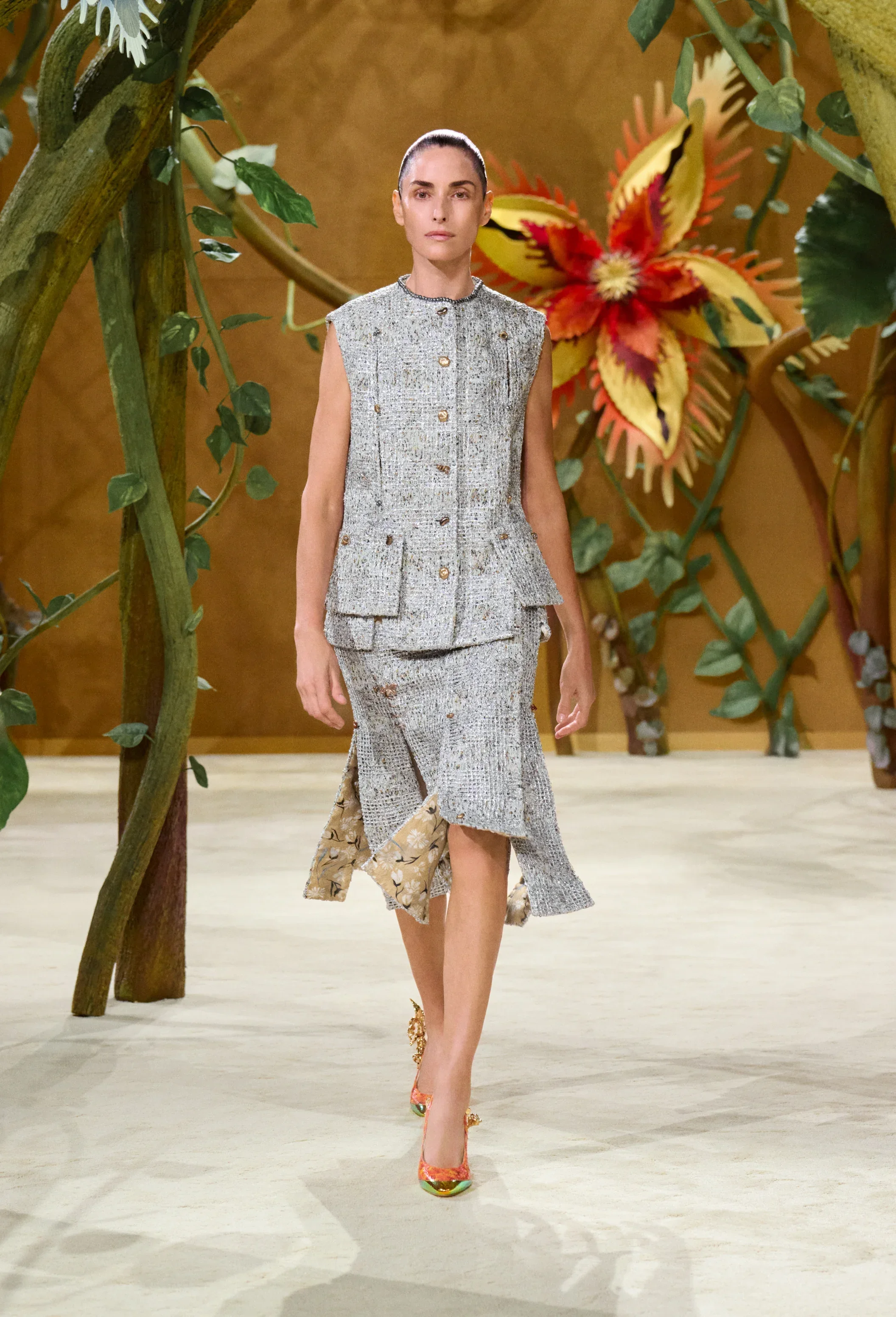 Chanel tweed suit with painted silk lining revealed at the hem