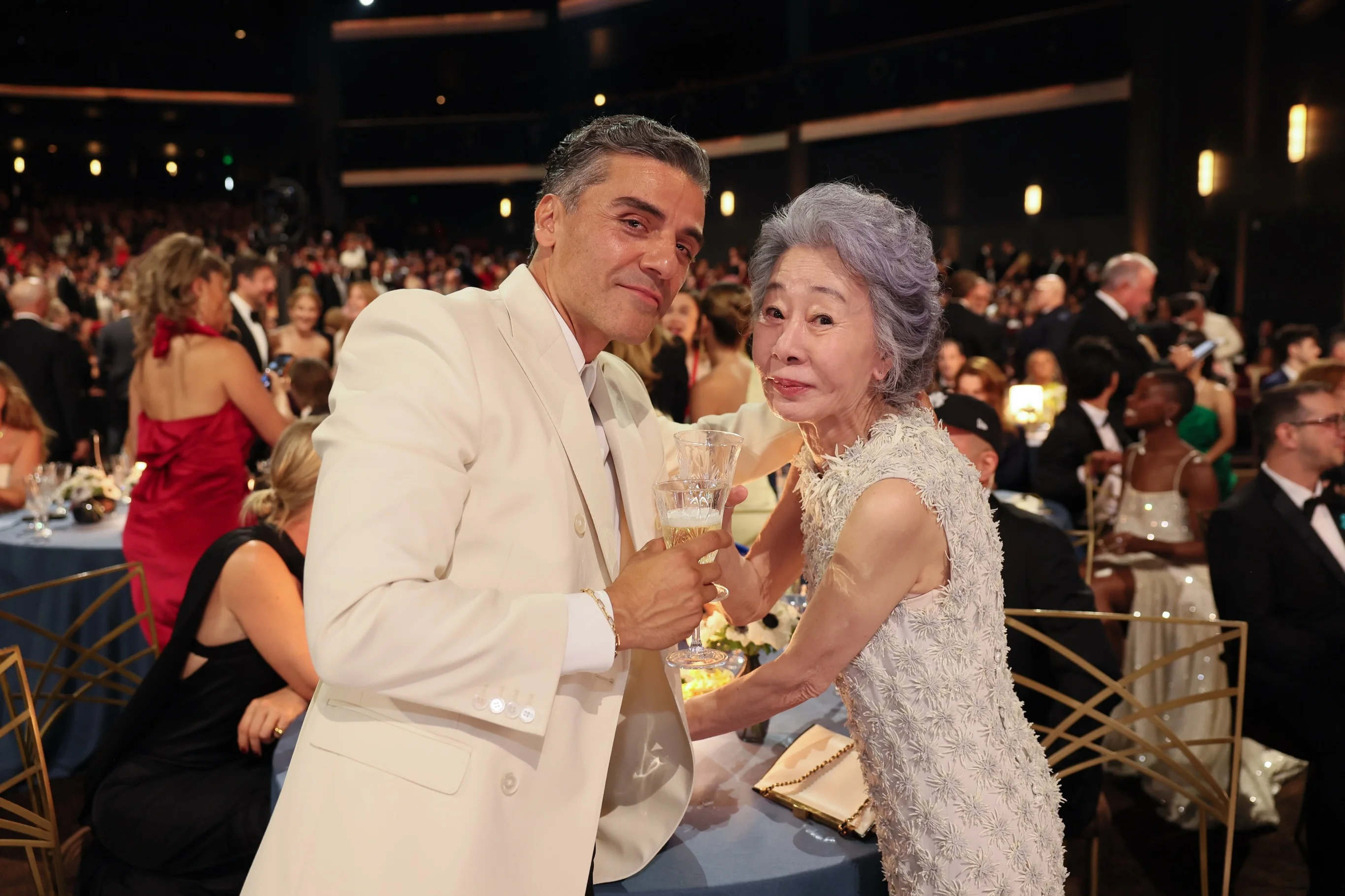 Steven Conrad holding Emmy award on stage