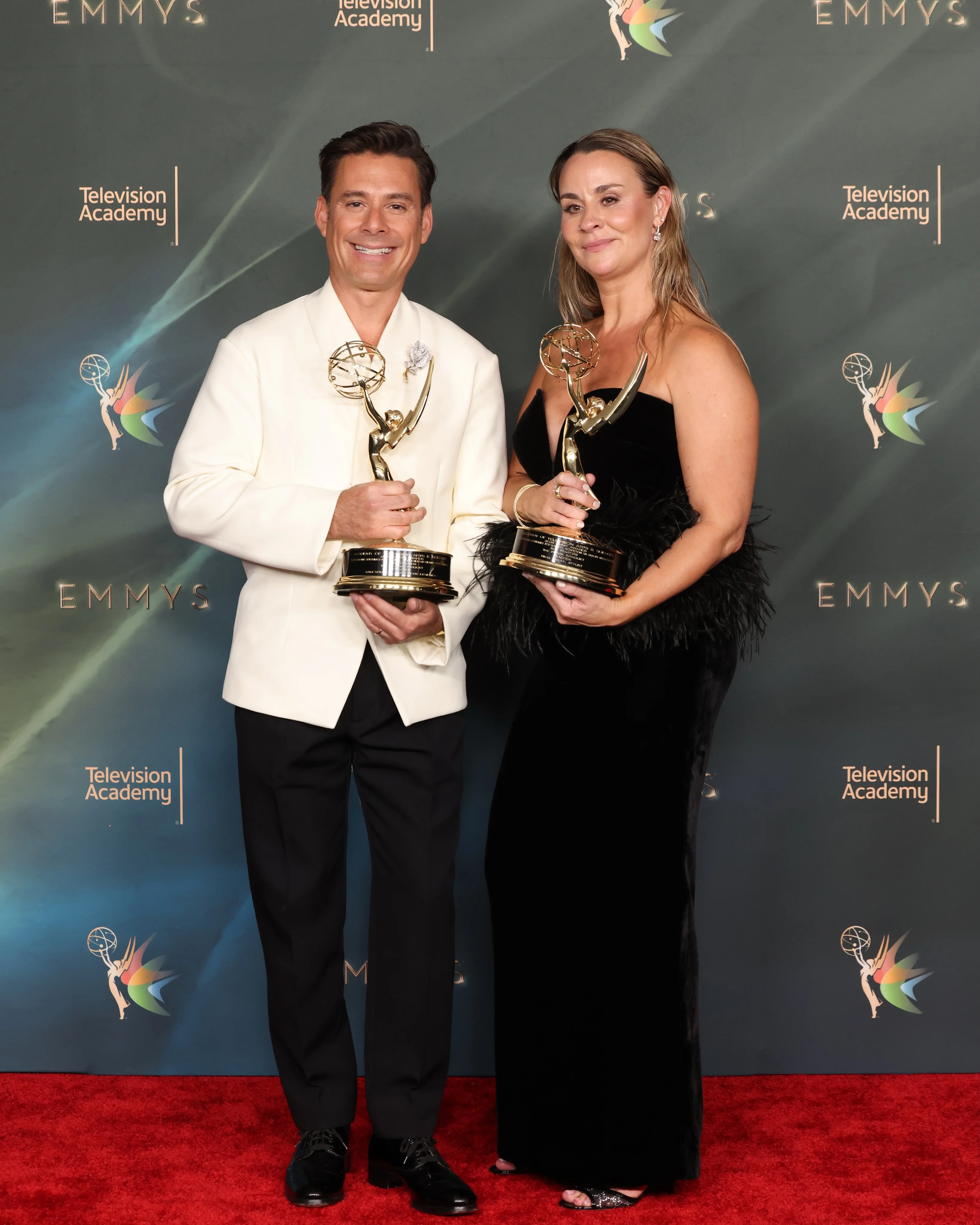 Ayo Edebiri clutching her golden Emmy with incandescent joy