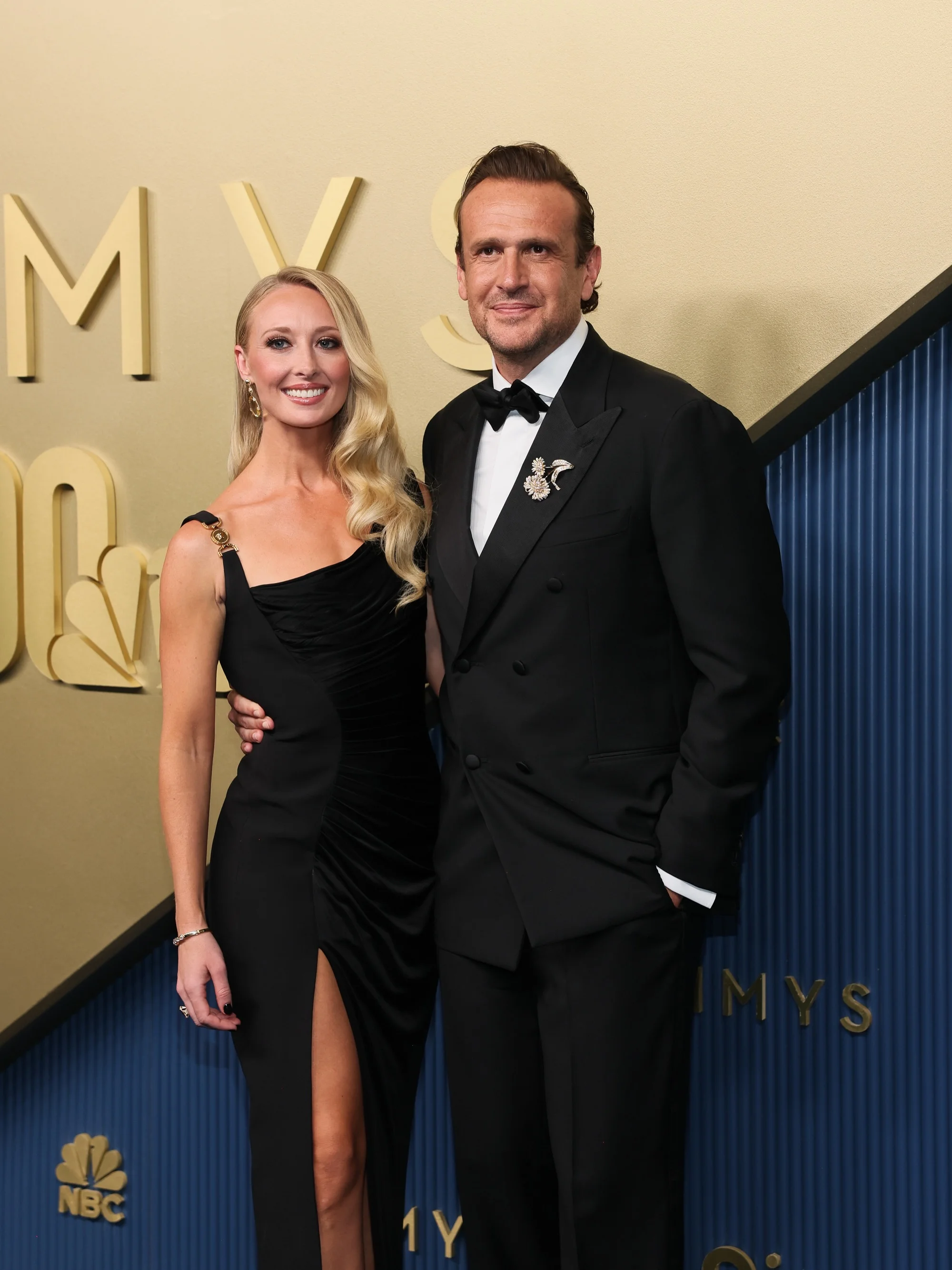 Jason Segel and partner posing on the red carpet