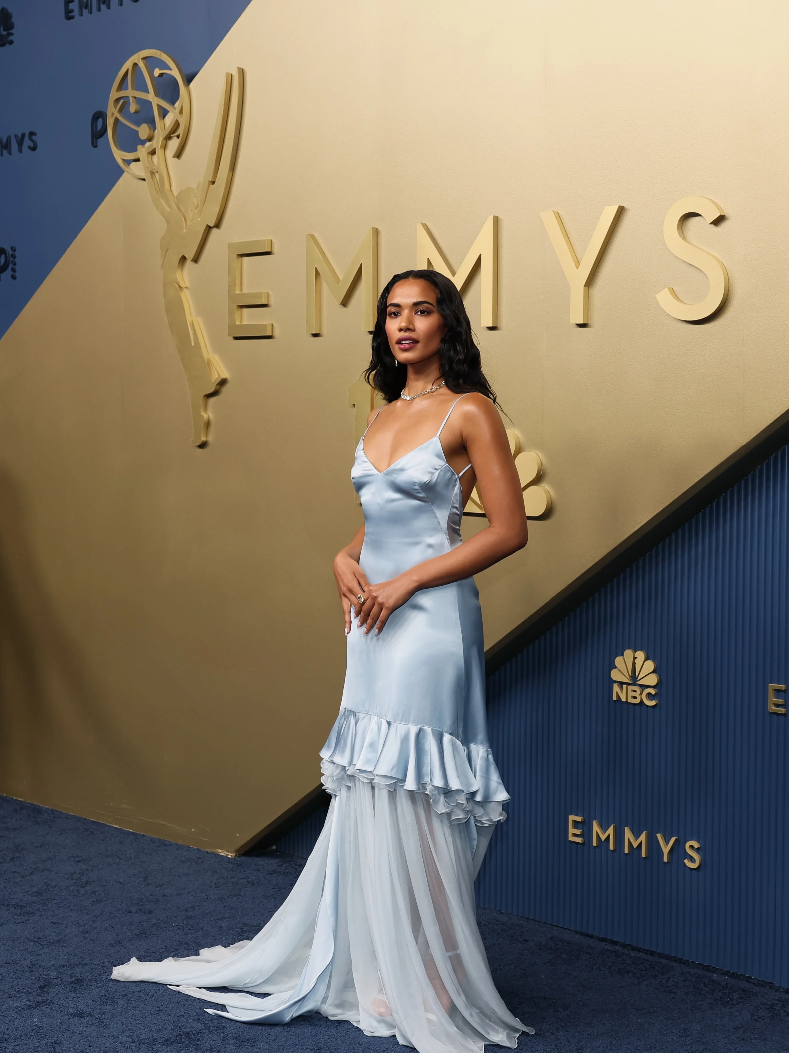 Rachel Zegler in powder blue tiered tulle and ruffled ballgown