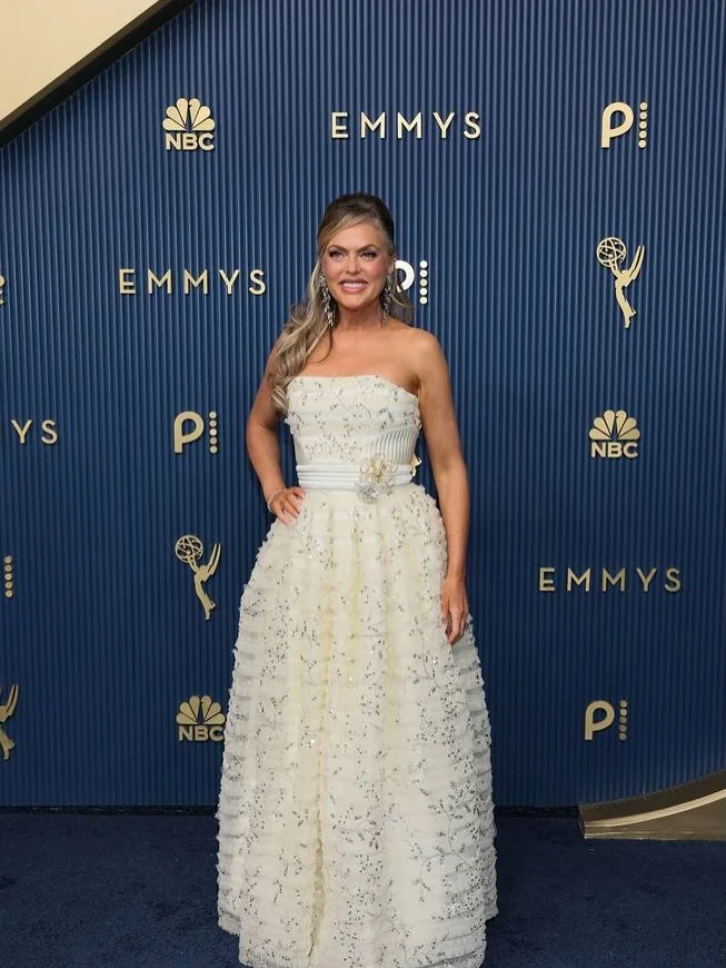 Kristin Chenoweth in tea-length ivory gown encrusted with pearls