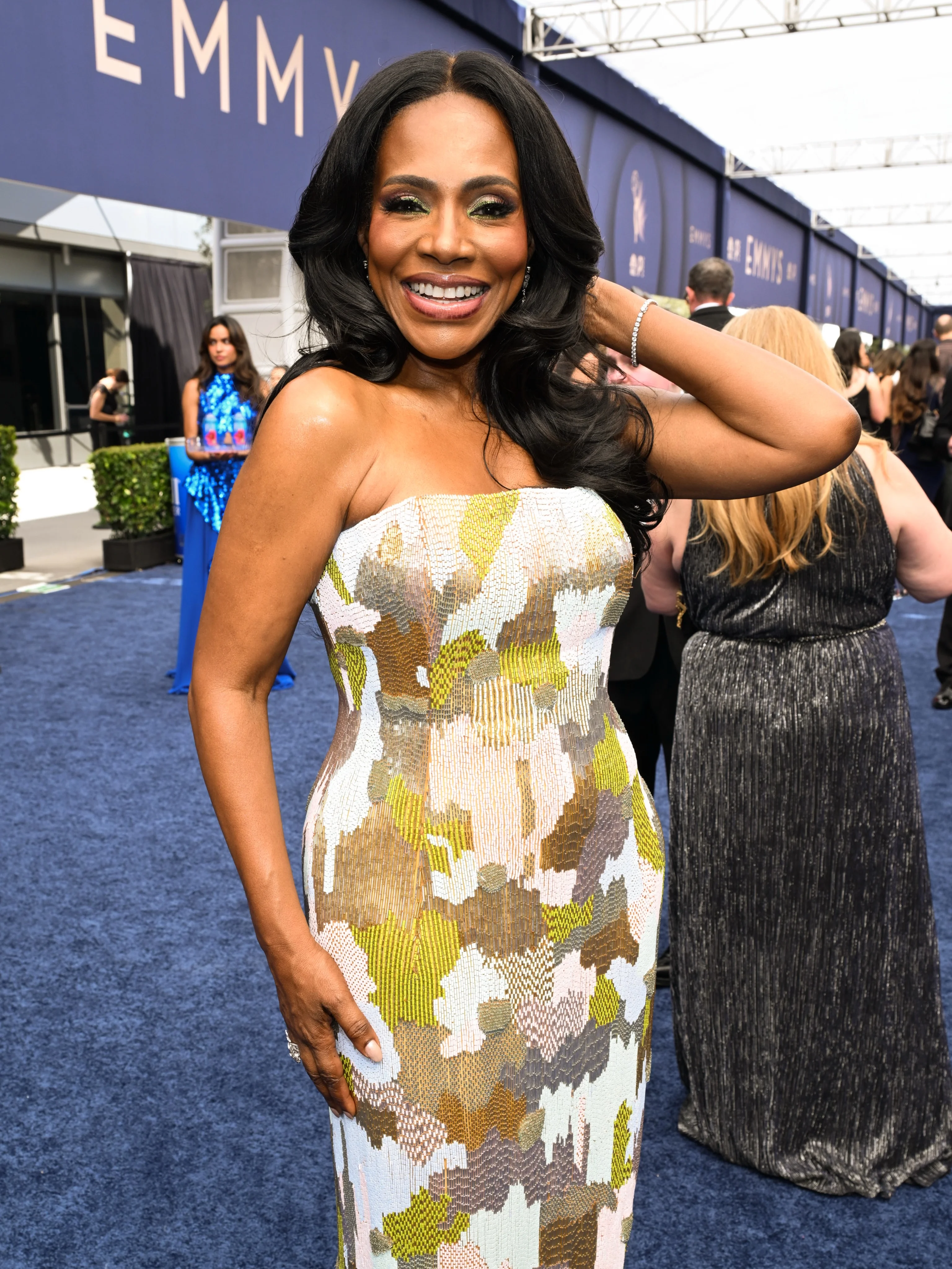Star in vibrant yellow and white graphic printed strapless gown