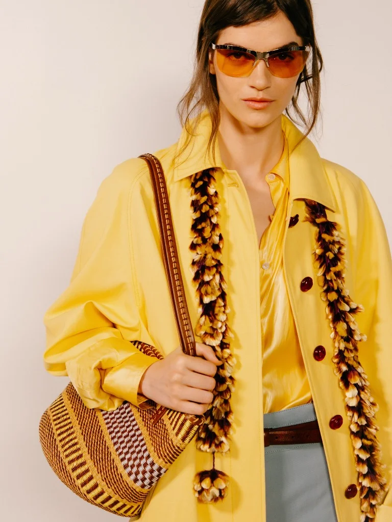 Tory Burch Spring 2027 yellow coat and feather boa