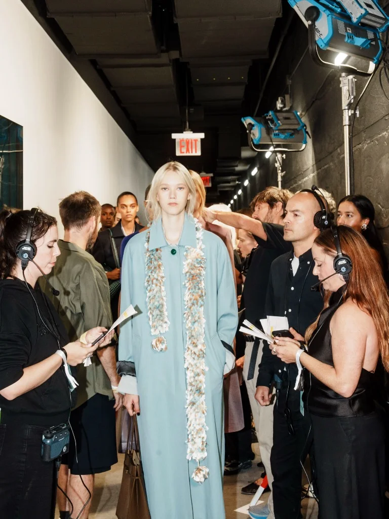 Models backstage lineup at the Tory Burch Spring 2027 runway show
